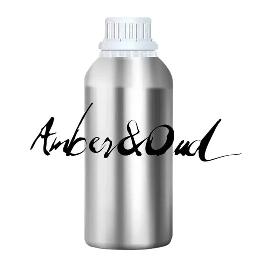A silver metal bottle with a white cap, featuring the text "Amber & Oud" written in a stylized font.